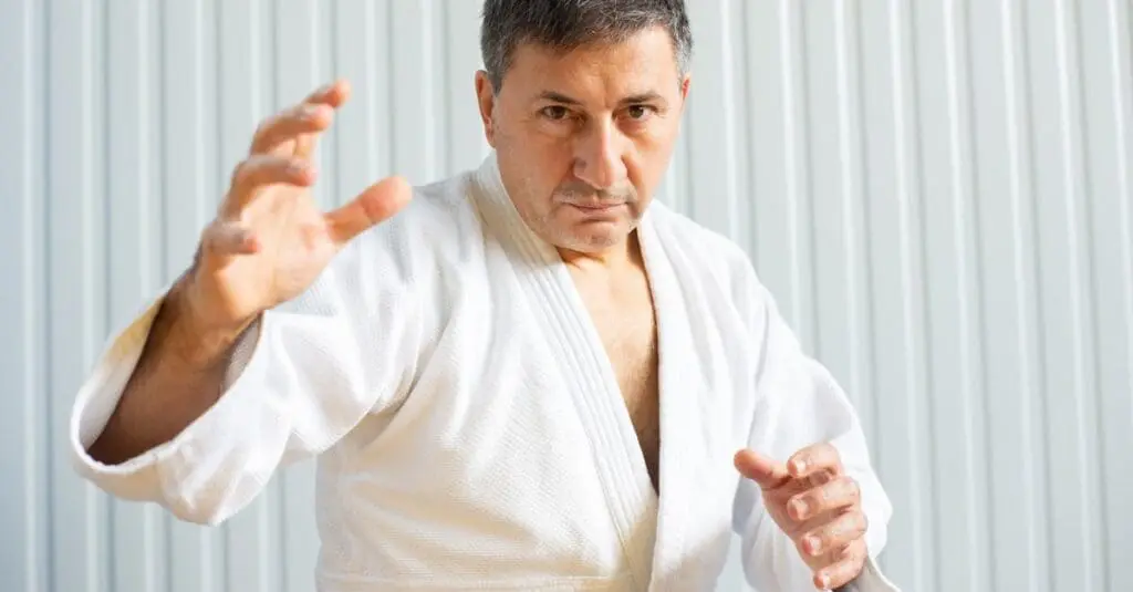 Adult practitioner holding guard stance for martial arts confidence