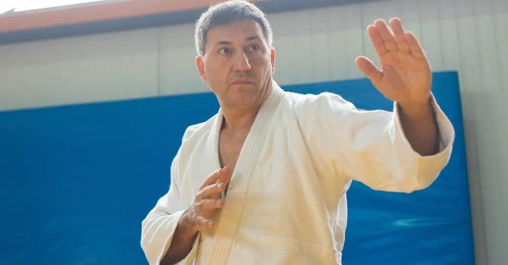 Martial artist demonstrating open-hand guard position for safety awareness skills