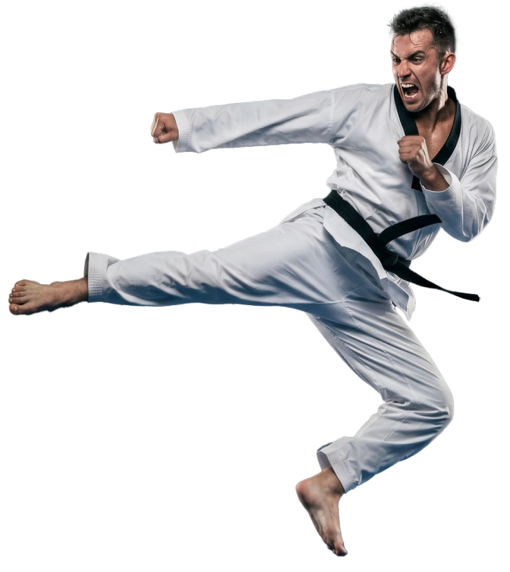 Taekwondo instructor demonstrating kicking techniques to students during a martial arts class.